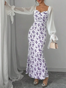 Detail of floral print maxi dress featuring elegant puff sleeves and tie-up cuffs