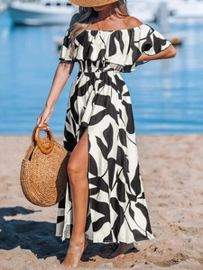 Off-shoulder black and white leaf print maxi dress with high slit and ruffled neckline