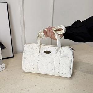 White Boston bag with silver stars, large travel tote featuring wide handle and retro metal tag