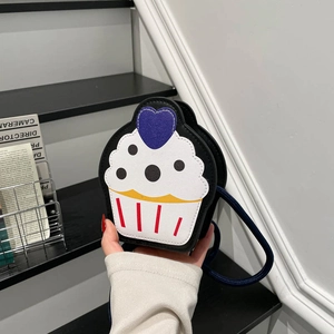 Mini cupcake-shaped colorful crossbody bag for kids with black leather and blue rope strap