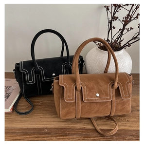 Chic vintage Boston bags in black and caramel brown with contrast stitching details