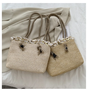 Detail of straw woven tote bags with sunflower floral trim and thick rope handles