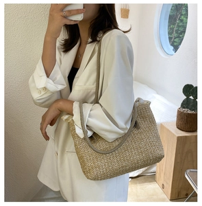Detail of hand-woven straw tote bag showing tight weave texture and drawstring lining