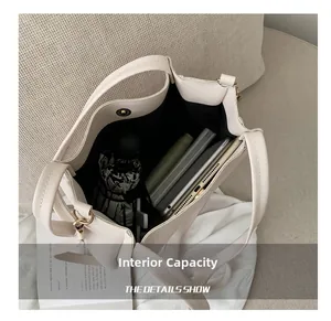 Detailed interior of a beige tote bag showing spacious capacity for tablets and umbrellas