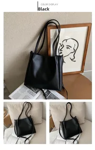 Minimalist black tote bag displayed in a warm home setting with elegant leather texture