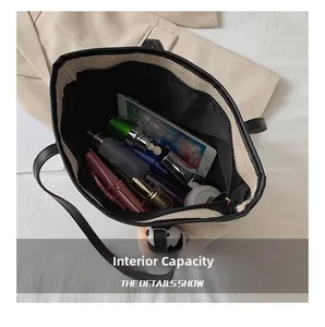 Detailed internal capacity of a beige tote bag showing tablet and cosmetic storage