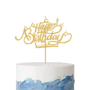 Golden Happy Birthday To You cake topper with crown design on a blue and white cake