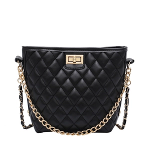Quilted black leather bucket bag with golden chain strap and metallic twist lock