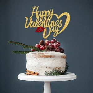 Golden glitter Happy Valentine's Day cake topper with red lips on white dessert