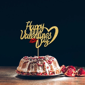 Detail of glitter Happy Valentines Day cake topper with red lip and heart design