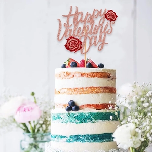 Rose gold glitter Happy Valentine's Day cake topper with red roses on cream cake