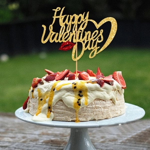 Glittering Happy Valentines Day cake topper with red lips on a cream cake