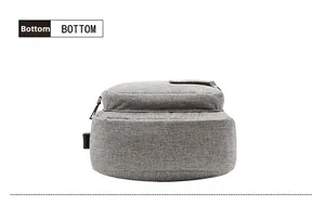 Detailed bottom view of grey sports chest bag with durable fabric and plastic buckle
