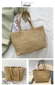 Detailed view of khaki woven tote bag showing fine texture and leather shoulder straps
