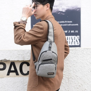 Grey casual crossbody chest bag for men with adjustable strap and multiple zipper pockets