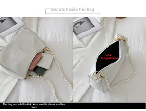 Detailed view of the white lace shoulder bag interior and its pearl chain strap decoration