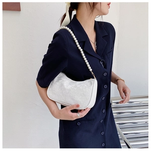 French retro white lace shoulder bag with elegant pearl chain strap shown on model