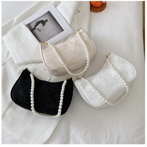Three pleated lace shoulder bags in black and white with elegant pearl chain straps