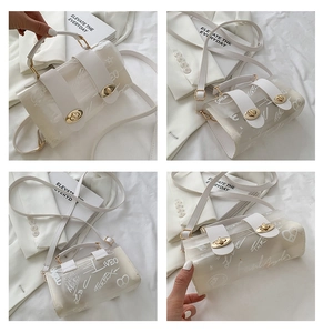 Detail of semi-transparent PVC jelly bag with graffiti print and gold twist locks