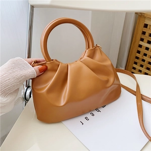 Caramel ruched cloud bag with wooden handle and crossbody strap minimalist design