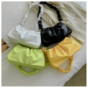 Close-up of pleated dumpling bags in four colors with matching ruched shoulder straps
