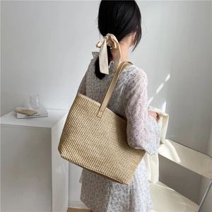 Stylish beige woven tote bag with brown leather handles, large capacity summer beach bag