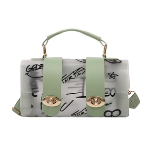 Light green semi-transparent frosted handbag with graffiti prints and gold twist locks