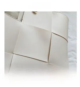 Close-up of the woven texture on this cream white faux leather large capacity tote bag