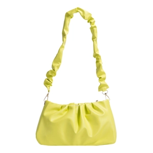 Fashionable neon yellow pleated cloud shoulder bag with matching chunky strap on white background
