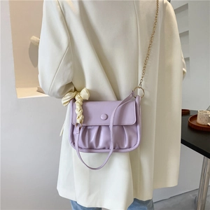 Minimalist light purple cloud bag with pleated design and gold chain shoulder strap