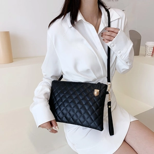 Classic black quilted crossbody bag with gold twist lock and slim shoulder strap