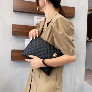 Quilted black PU leather envelope clutch bag with gold clasp and wrist strap