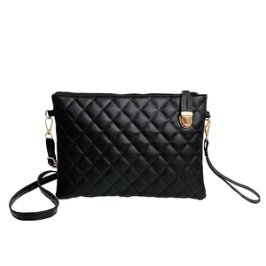 Classic black quilted faux leather crossbody bag with gold hardware and zipper