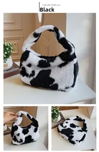 Detail of cow print faux fur tote bag showing soft plush texture and white zipper closure