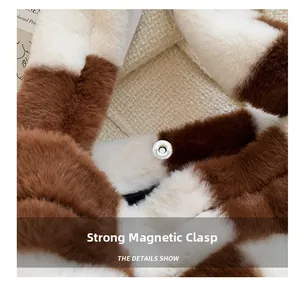 Detail of strong silver magnetic buckle closure on plush checkered tote bag fabric