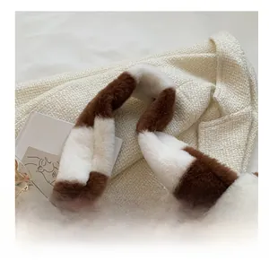 Detailed close-up of wide comfort strap and brown striped plush faux fur tote bag texture