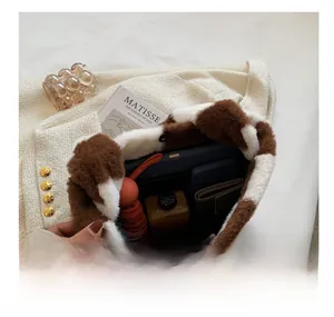 Macro view of the large capacity interior space of the brown checkered plush tote bag