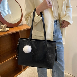 Large black PU leather tote bag with smile pattern and white faux fur pompom