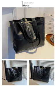 Detail view of large black glossy PU leather tote bag with magnetic closure and dual straps