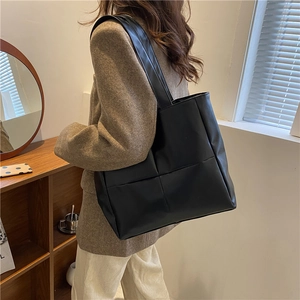 Minimalist black woven oversized tote bag in PU leather for women stylish shoulder bag