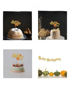 Glittery Happy Thanksgiving banner and cake toppers with maple leaves for party decor