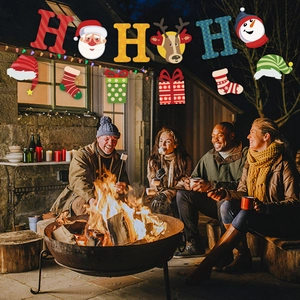 Outdoor festive setting showing HO HO HO Christmas banners with colorful cartoon pendants