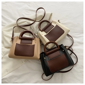 Detailed set of retro contrast handbags with round handles and metal rivet accents