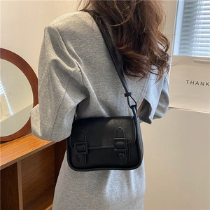 Minimalist black leather crossbody square bag with flap and dual decorative straps