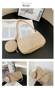 Detail of khaki straw woven underarm bag featuring a small round coin purse and gold hardware