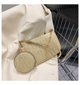 Detail of woven straw handbag featuring chevron pattern and small round coin purse