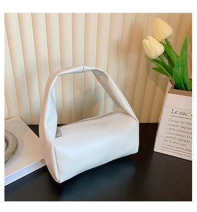 Minimalist white soft PU leather handbag with zipper and single handle detail