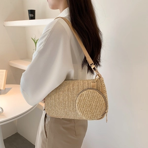 Women's woven straw shoulder bag with mini coin purse and khaki PU strap on model