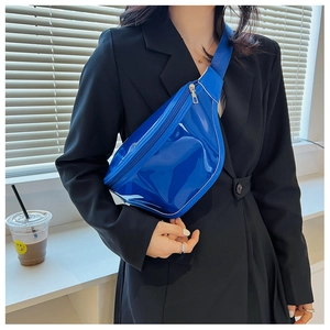 Close-up of klein blue shiny waterproof chest bag with silver zipper and nylon strap