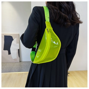 Rear view of model wearing neon green transparent PVC waist bag with black buckle strap